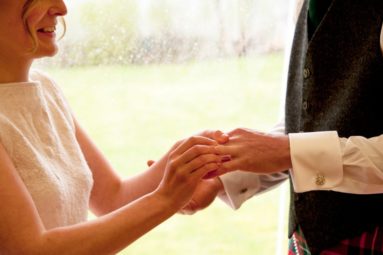 Bride-Putting-Ring-on-Groom